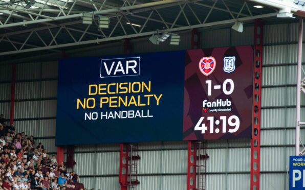 The big screen at Tynecastle showed the VAR penalty decision. Image: SNS