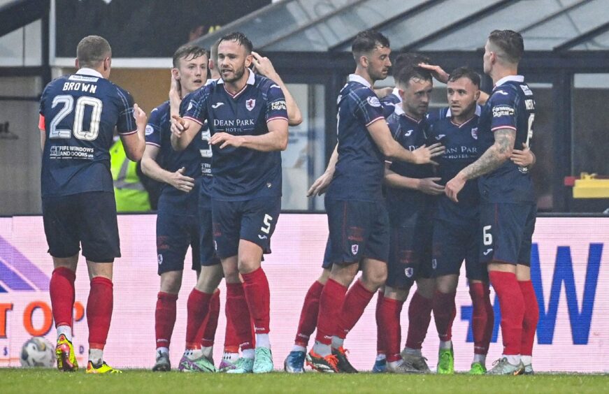 Lewis Vaughan accepts the congratulations of his Raith Rovers team-mates.