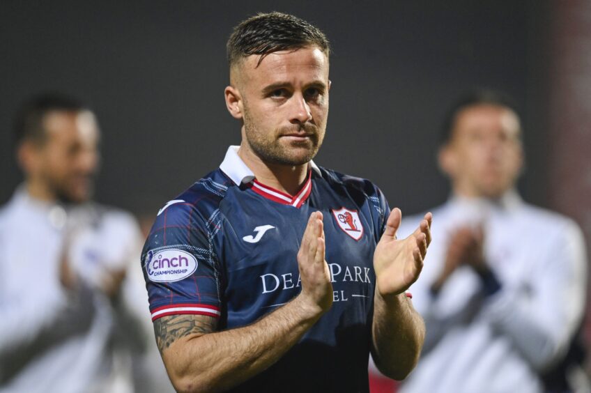 Lewis Vaughan claps his hands after Raith Rovers' victory.