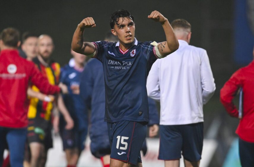 Raith Rovers defender Dylan Corr celebrates at full-time with two clenched fists.