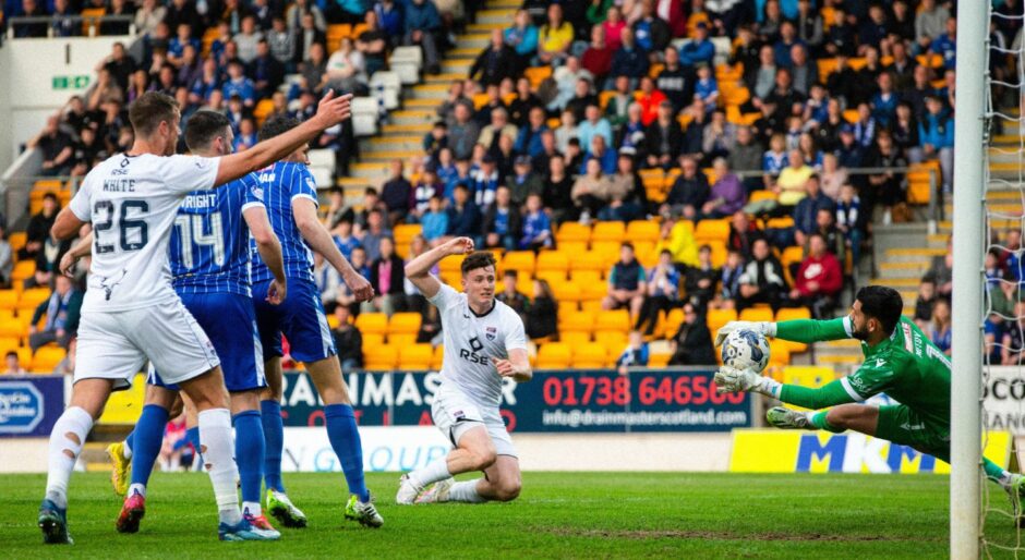 Ross County's George Harmon has an early shot saved by Dimitar Mitov.