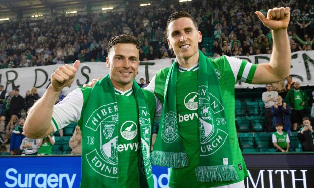 Hibs pair Lewis Stevenson and Paul Hanlon give the thumbs up to the camera.