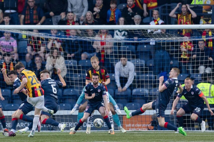 Raith Rovers skipper Scott Brown prepares to block a shot from Partick Thistle's Dan O'Reilly.