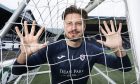 Raith Rovers keeper Kevin Dabrowski looks through the goal net at Stark's Park.