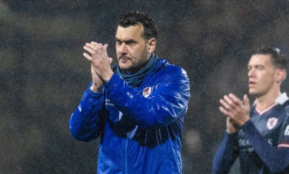 Manager Ian Murray claps the Raith Rovers supporters.