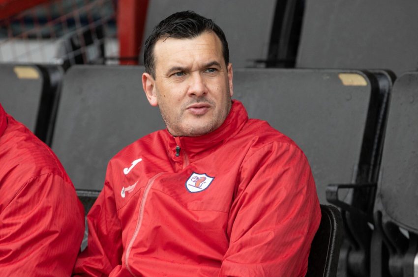 Raith Rovers manager Ian Murray looks into the distance.