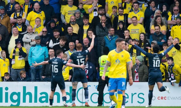 Ross County's Simon Murray celebrates in front of the colourful Raith Rovers support.