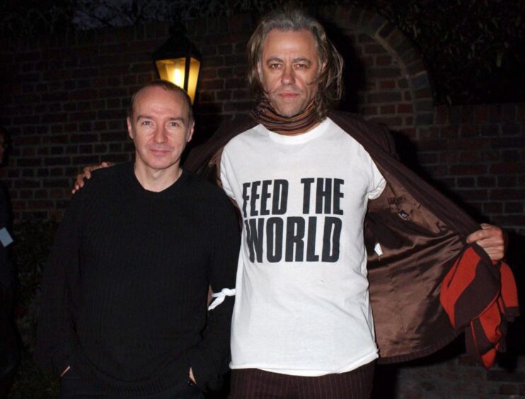 Midge Ure, left, and Sir Bob Geldof leave Air Studios in north London after the re-recording of 'Do They Know It's Christmas?' in 2004.