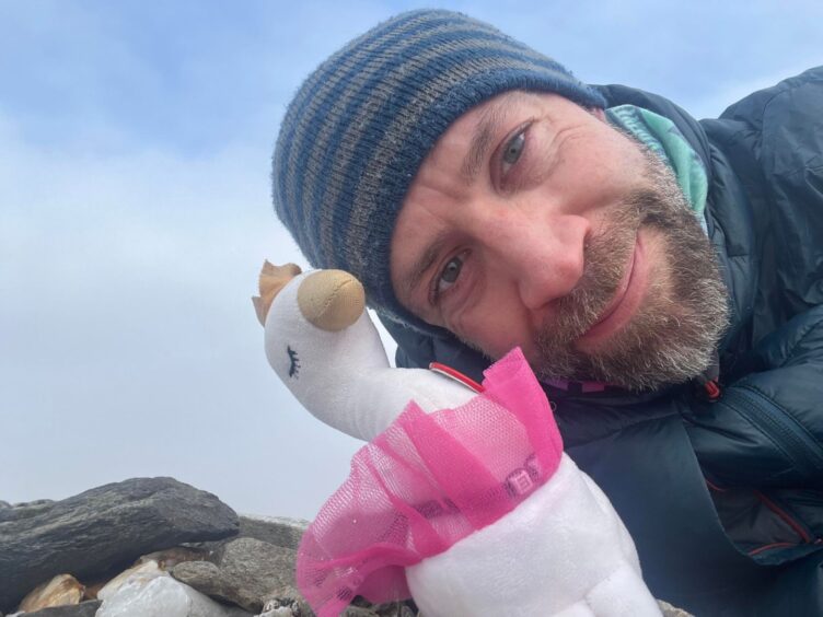 Allan MacRaild selfie with pink soft toy swan