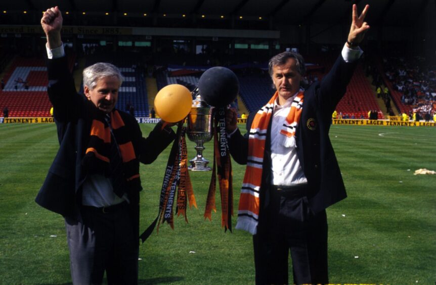 Dundee United assistant coach Gordon Wallace (left), and Ivan Golac celebrate with the Scottish Cup