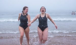 St Andrews University students enjoy the May Day dip.