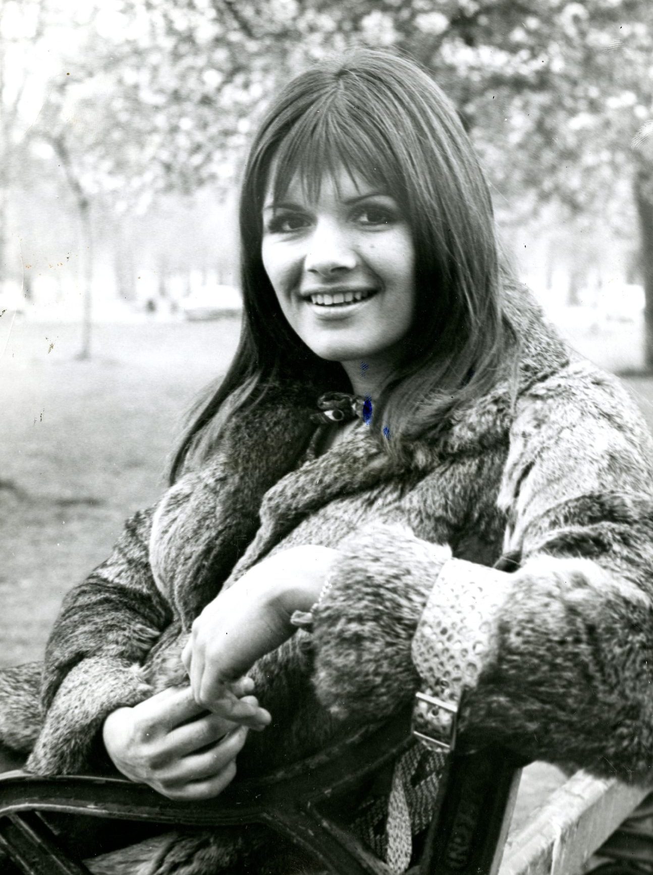 Eve Graham, in a fur coat on a park bench, in April 1971 during her time with the band.