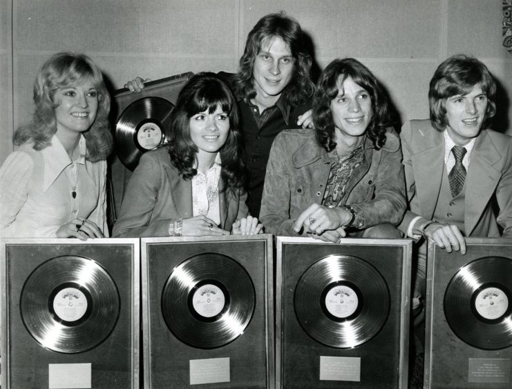 The New Seekers in 1972, showing off their framed discs. 