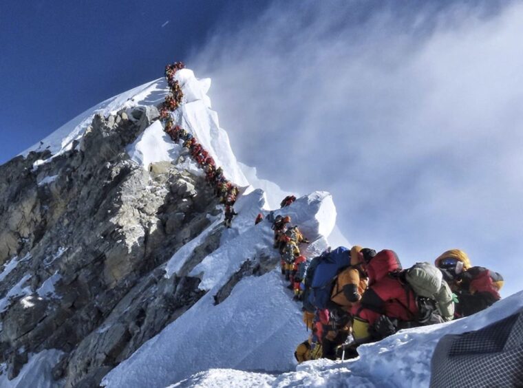 Queue of climbers at summit of Everest