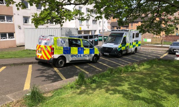 Police and paramedics at Ancrum Court, Dundee. Image: James Simpson/DC Thomson