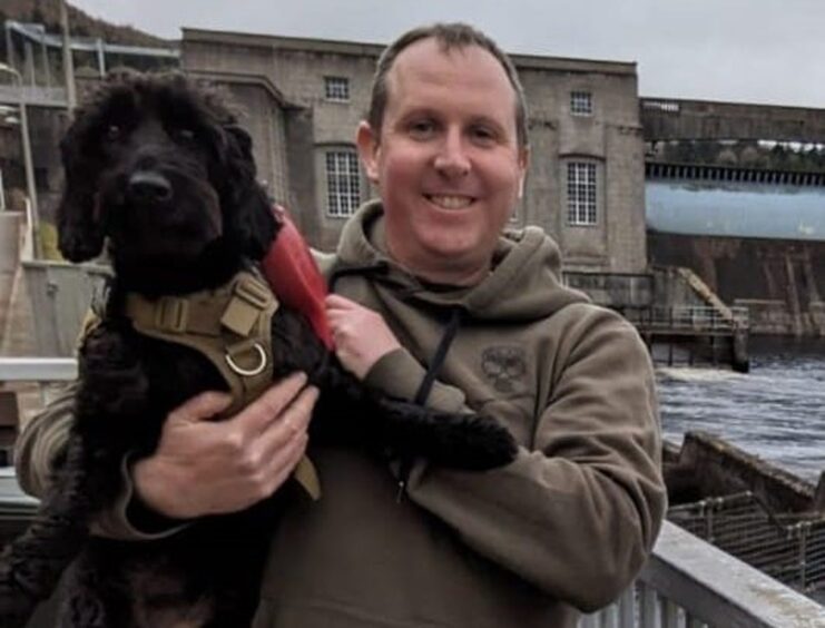 Andrew enjoys going for walks with his dog Shadow.