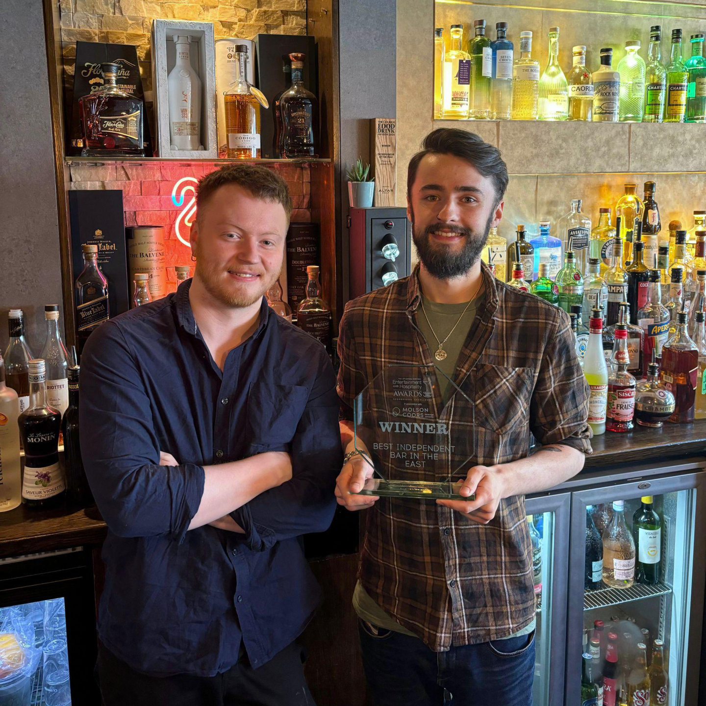 Jake Taylor and John Wallace celebrate their Scottish Entertainment Award at the Bruach bar.