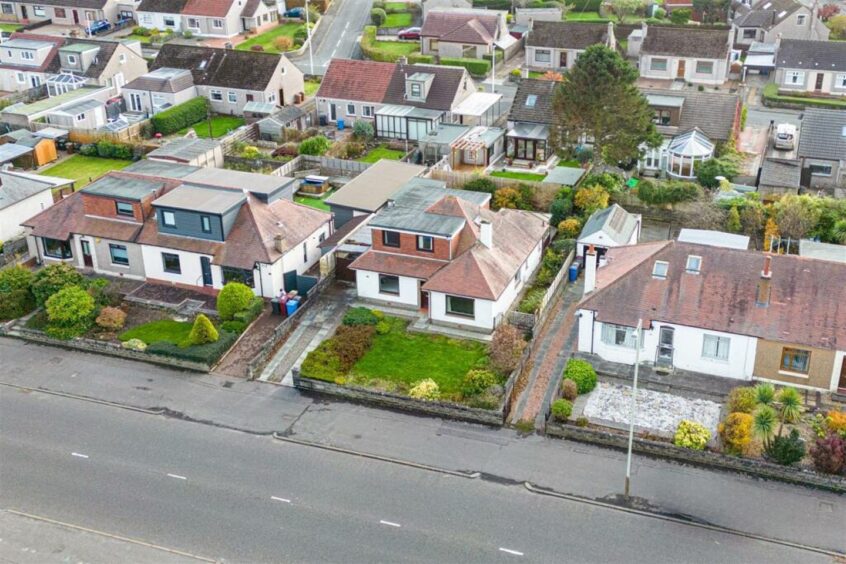 A lawn sits to the from of the Dundee home 