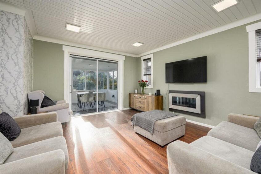 Patio doors lead to the sun room. 