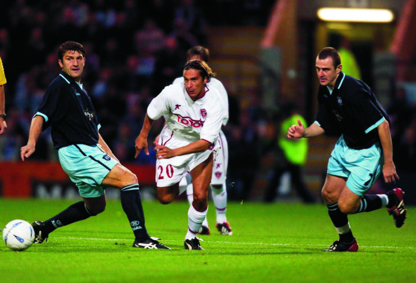 Perugia's Fusani gets between Giorgi Nemsadze and Dave Mackay in the 2003 UEFA Cup tie.