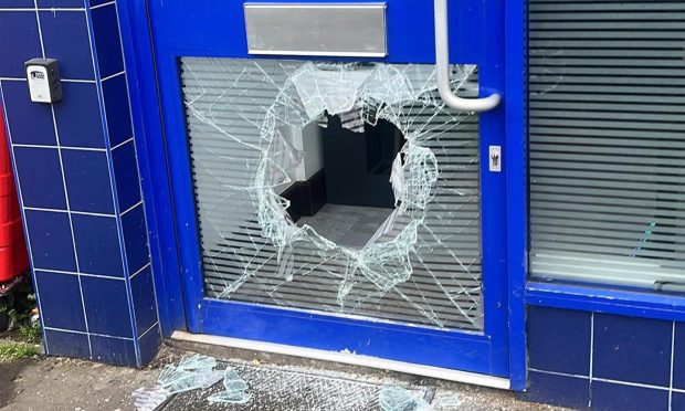 The smashed door at the Leven cafe after break in