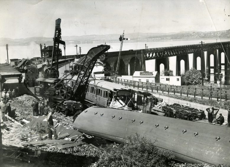 The derailed train and twisted metal debris after the Wormit rail accident in Fife