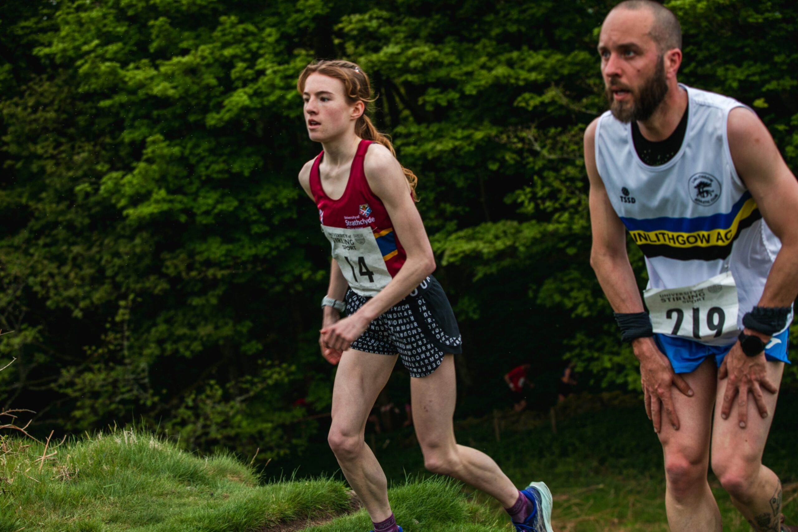 Two runners make their way around the course.