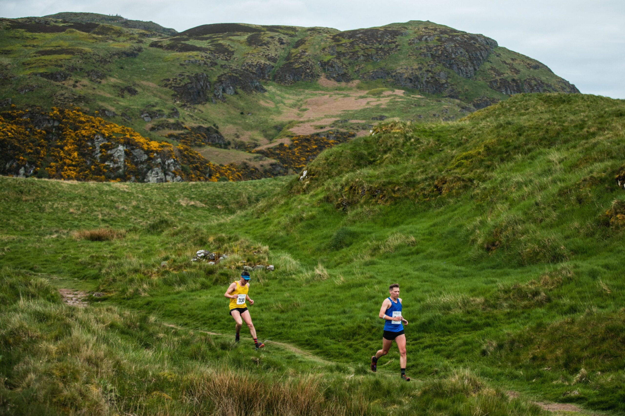 Runners make their way down the hill.