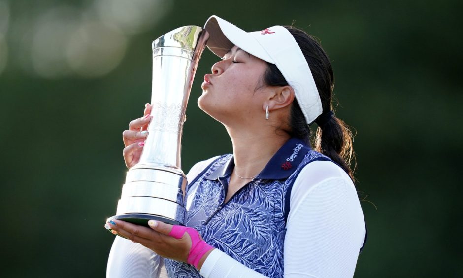 Last year's Women's Open winner Lilia Vu poses with her trophy. 
