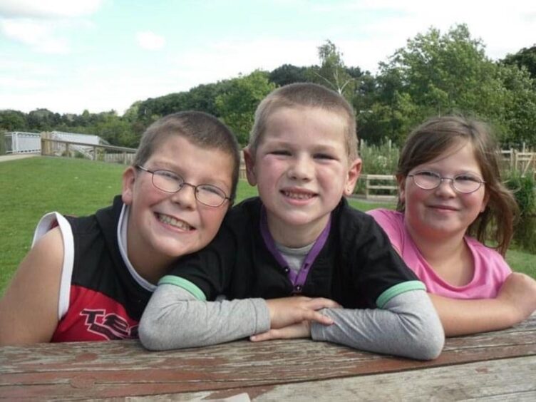Gareth aged-eight, centre with brother Arron and sister Chloe.