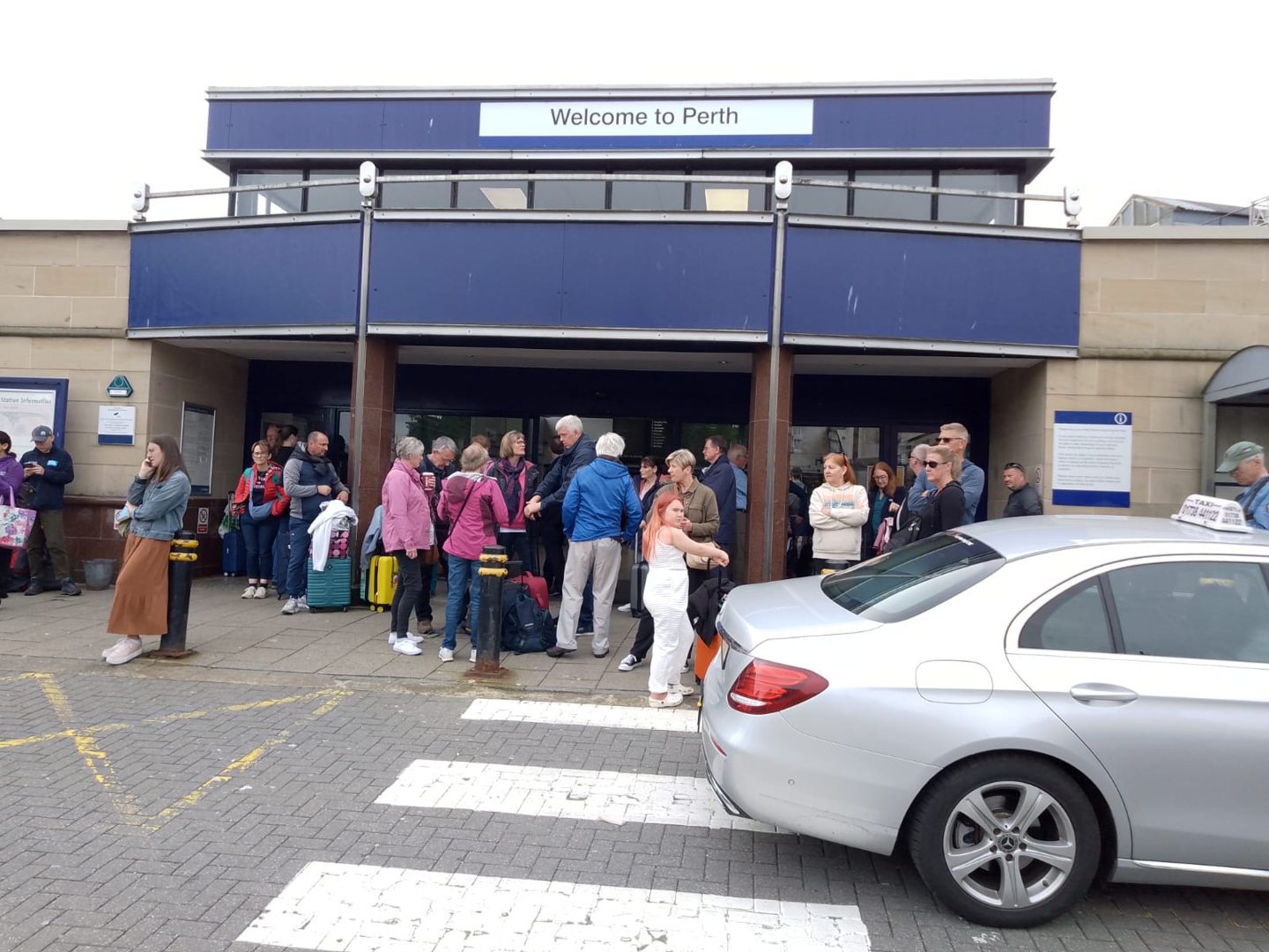 Passengers outside Perth Station.