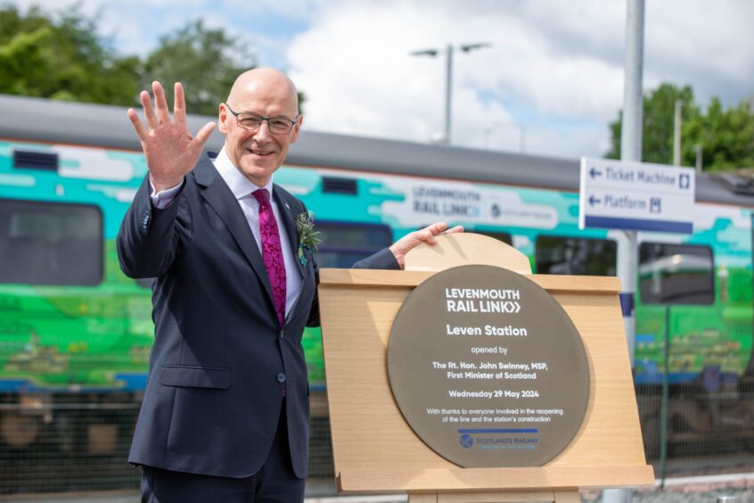John Swinney unveils plaque at new Leven station.