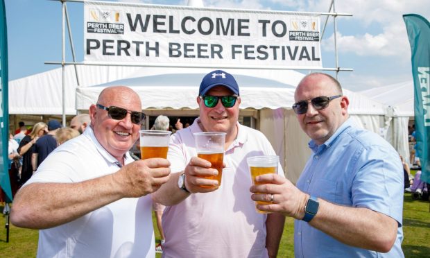 Ewen Christie, Dave Barnett and Neil McVean from Perth enjoy the beer on offer. Image: Kenny Smith/DC Thomson