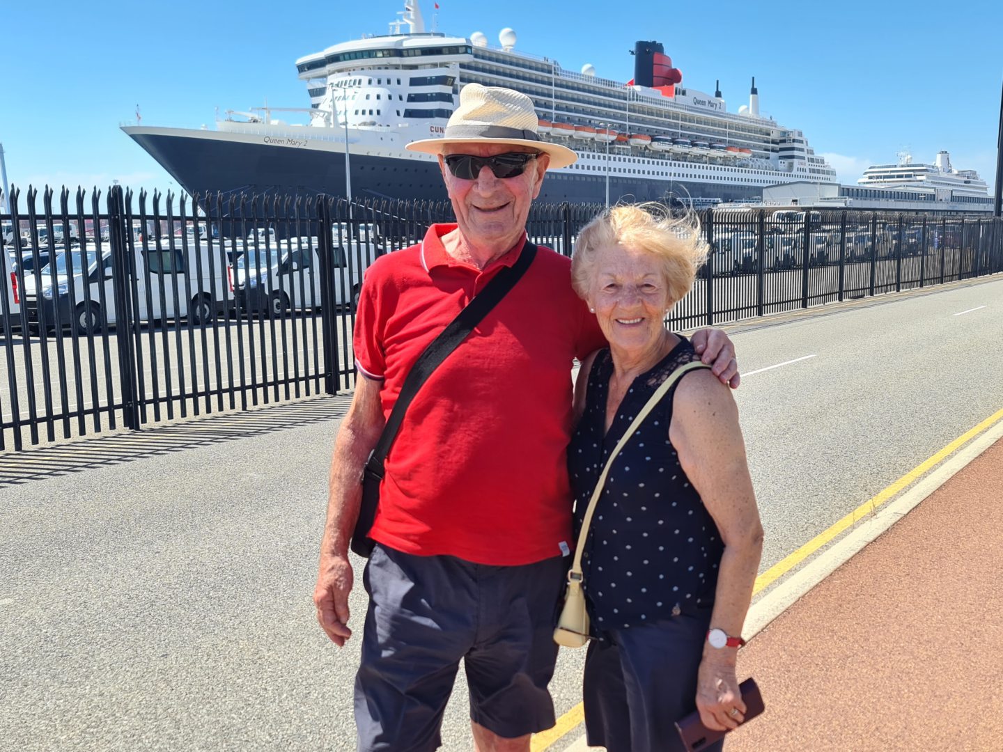 Bill and Anne Black in front of Queen Mary 2 in Freemantle, Australia. 