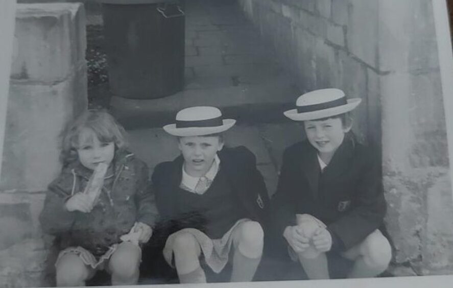 Marie went to primary school in Bath. She is pictured with her sister and a friend. 