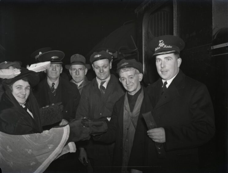A crowd standing next to the train before the final journey in January 1955.
