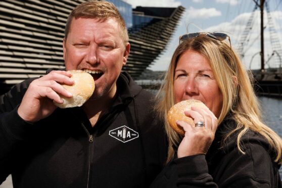 Murdoch Allan owners Paul and Katrina Allan with the new Dundee Roll. Image: Murdoch Allan