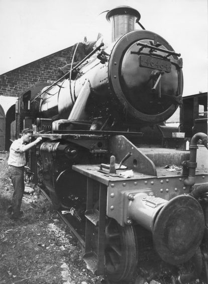 The locomotive being painted in 1978. 