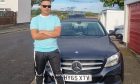 Roshan Baral with his Mercedes.
