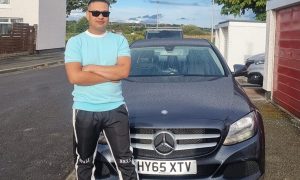 Roshan Baral with his Mercedes.