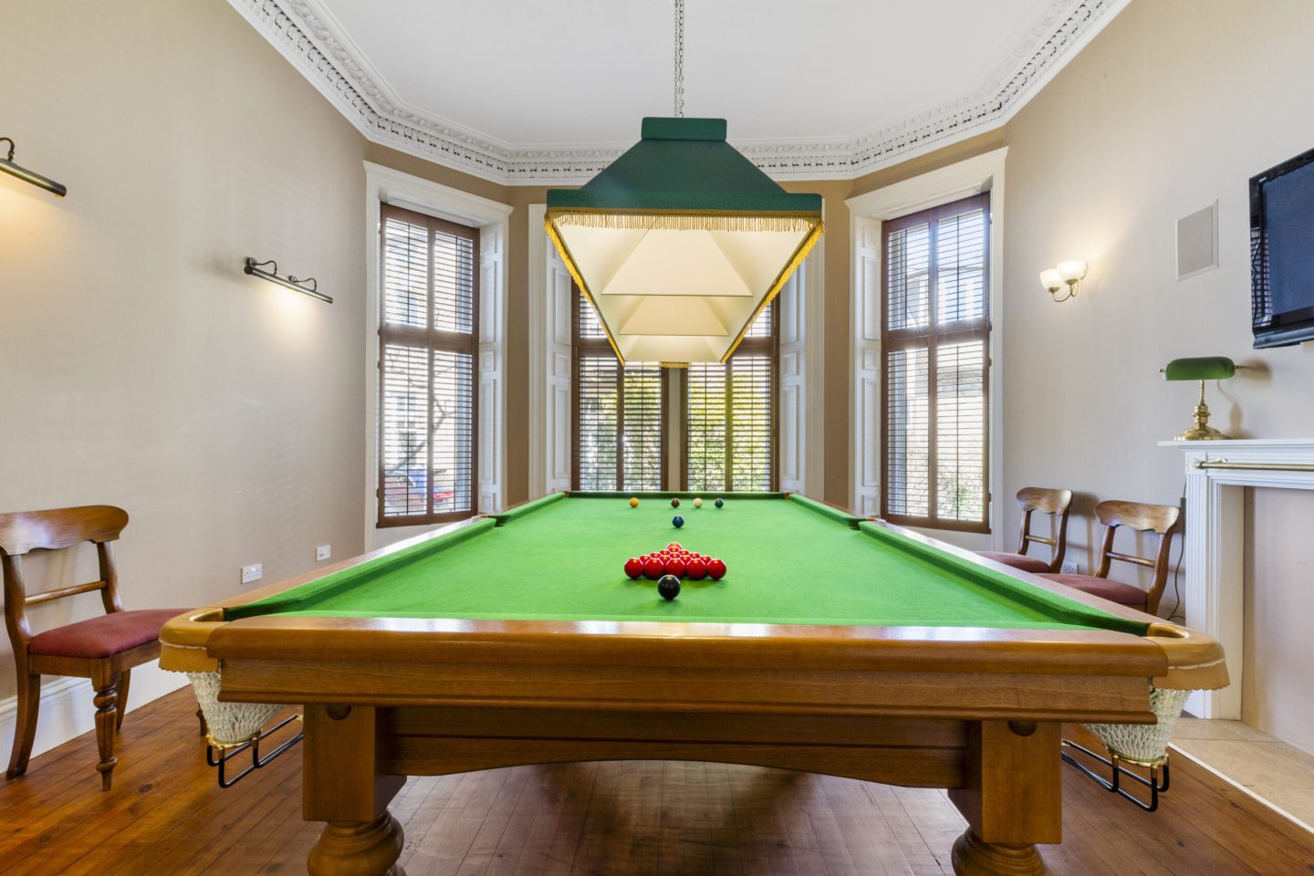 A snooker table in one of the rooms.