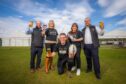 Perth Beer festival organisers holding glasses in front of marquee on North Inch park