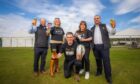 Perth Beer festival organisers holding glasses in front of marquee on North Inch park