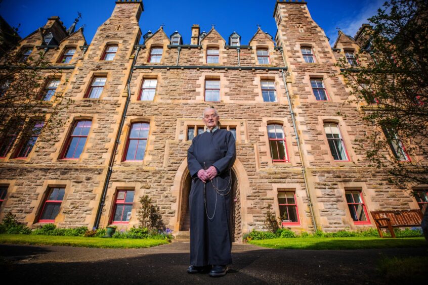 Father James MacManus outside St Mary's Monastery on Kinnoull Hill, Perth.