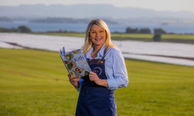 CR0048258 - Isla Glen Story - Perthshire area - Sarah Rankin will be launching her cookbook, Kith: Scottish Seasonal Food for Family and Friends, at Loch Leven Larder. Picture shows Sarah Rankin and her new book  ---- Loch Leven's Larder, Kinross - Thursday 16th May 2024 Image: Steve MacDougall/DC Thomson