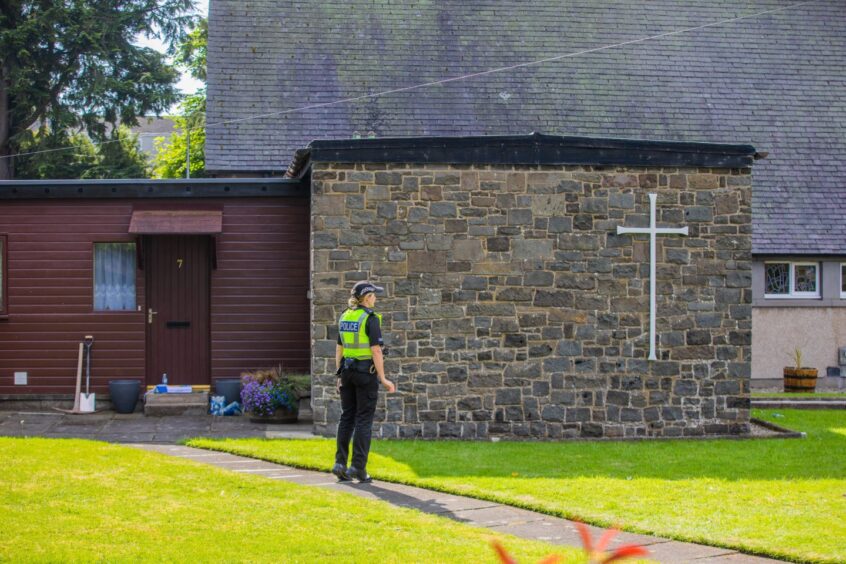 Police officer at St Mary Magdalene's Church.