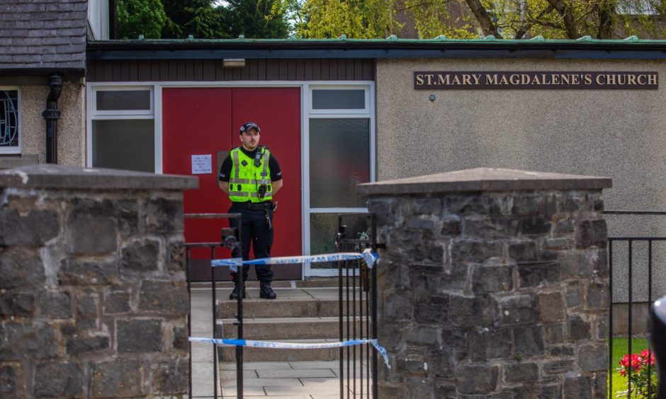 Police at St Mary Magdalene's Church in Perth on Saturday.
