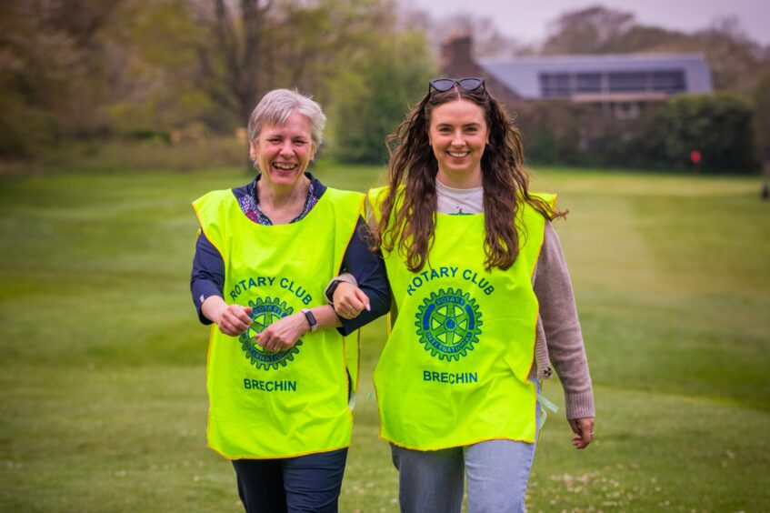 Jackie Williamson (left) and Aria Kennedy helped out the Rotary Club for the event for MND Scotland.