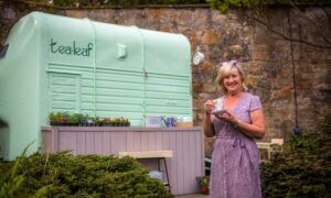 Sandra Bannister with here horsebox coffee shop in the own garden in the shadow of Culross Abbey.