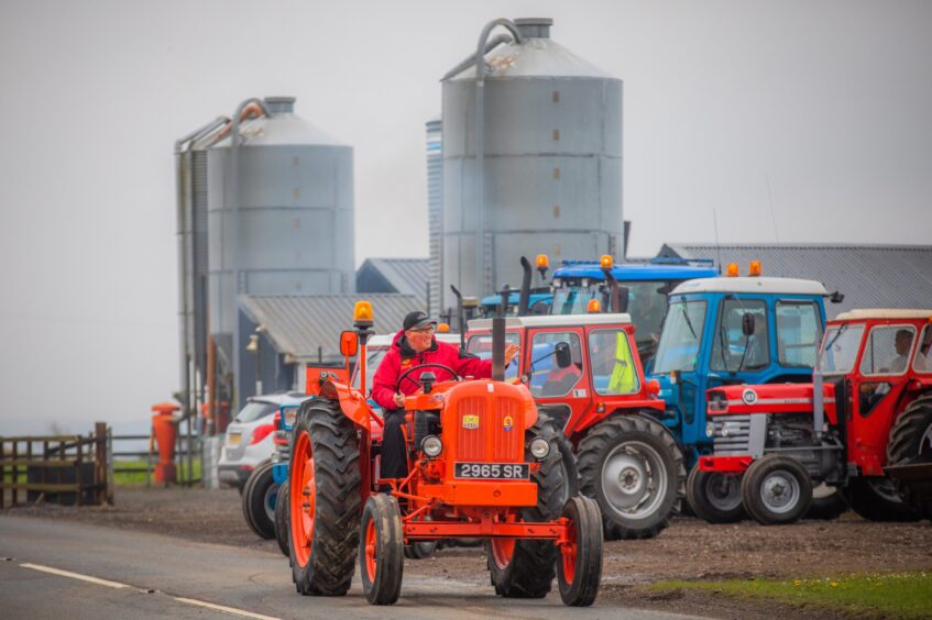 Dave Findlay leading a convoy of classic tractors on a charity run.